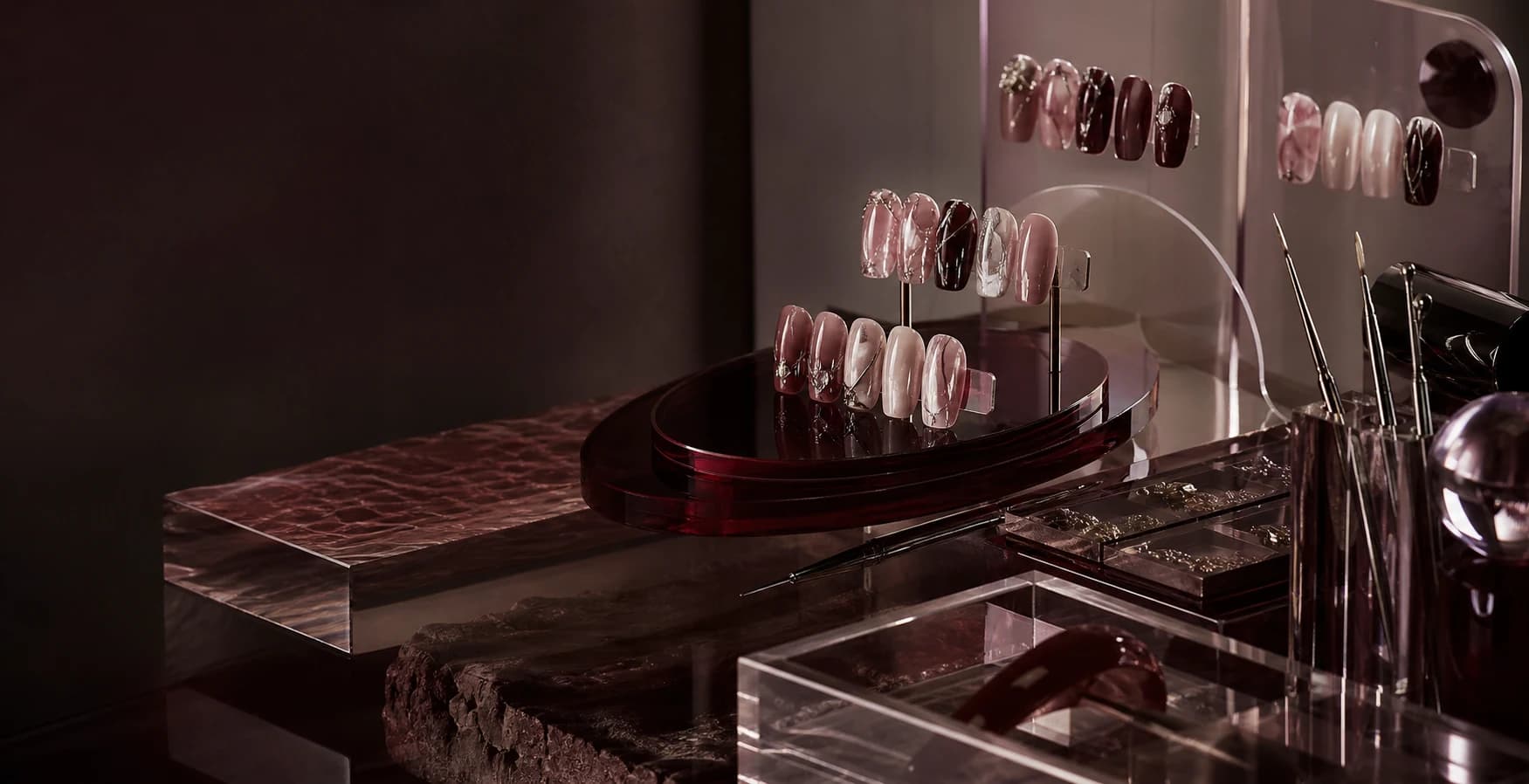 Handmade press-on nail sets displayed in an artist's studio